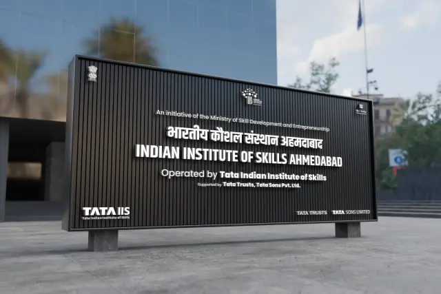 IIS Ahmedabad: The Ahmedabad campus board, black on the forecourt.